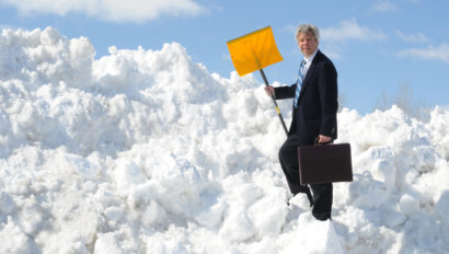 Business Man with Snow Shovel