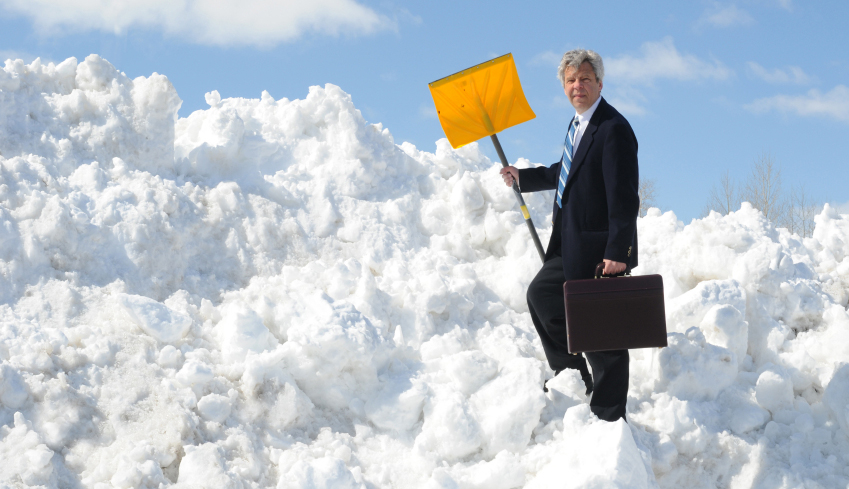 Business Man with Snow Shovel