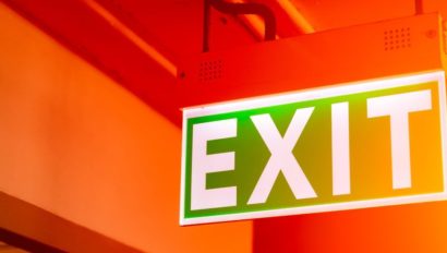 Exit sign against a red background