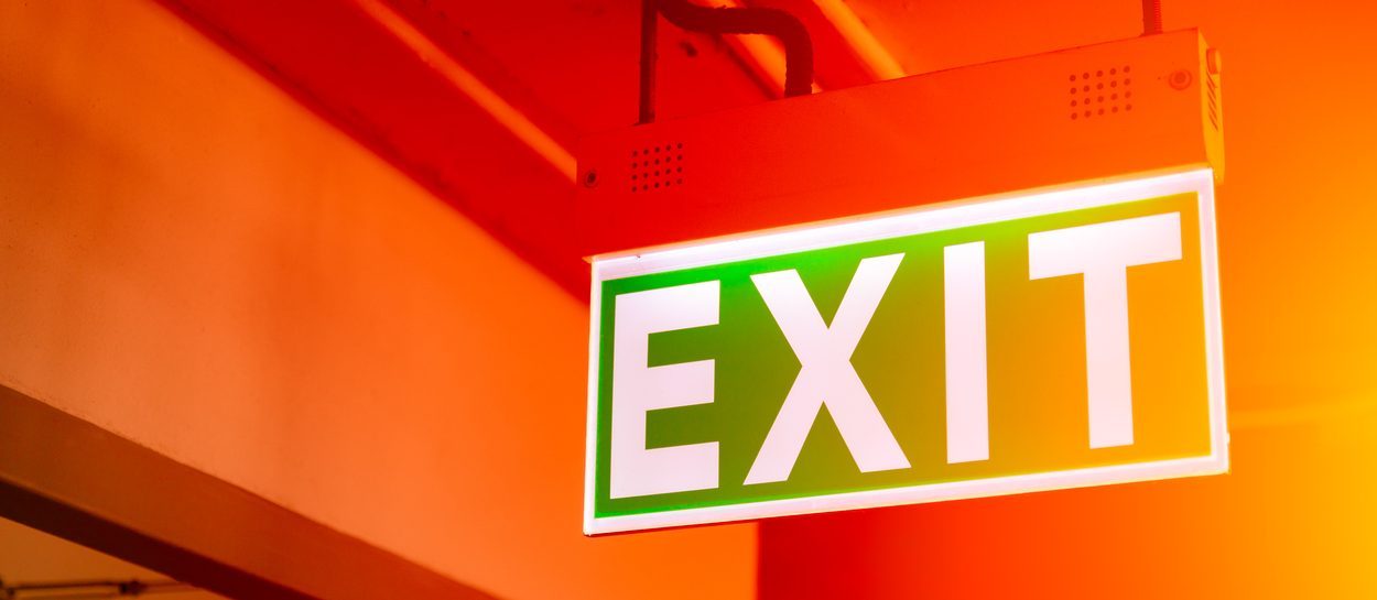 Exit sign against a red background