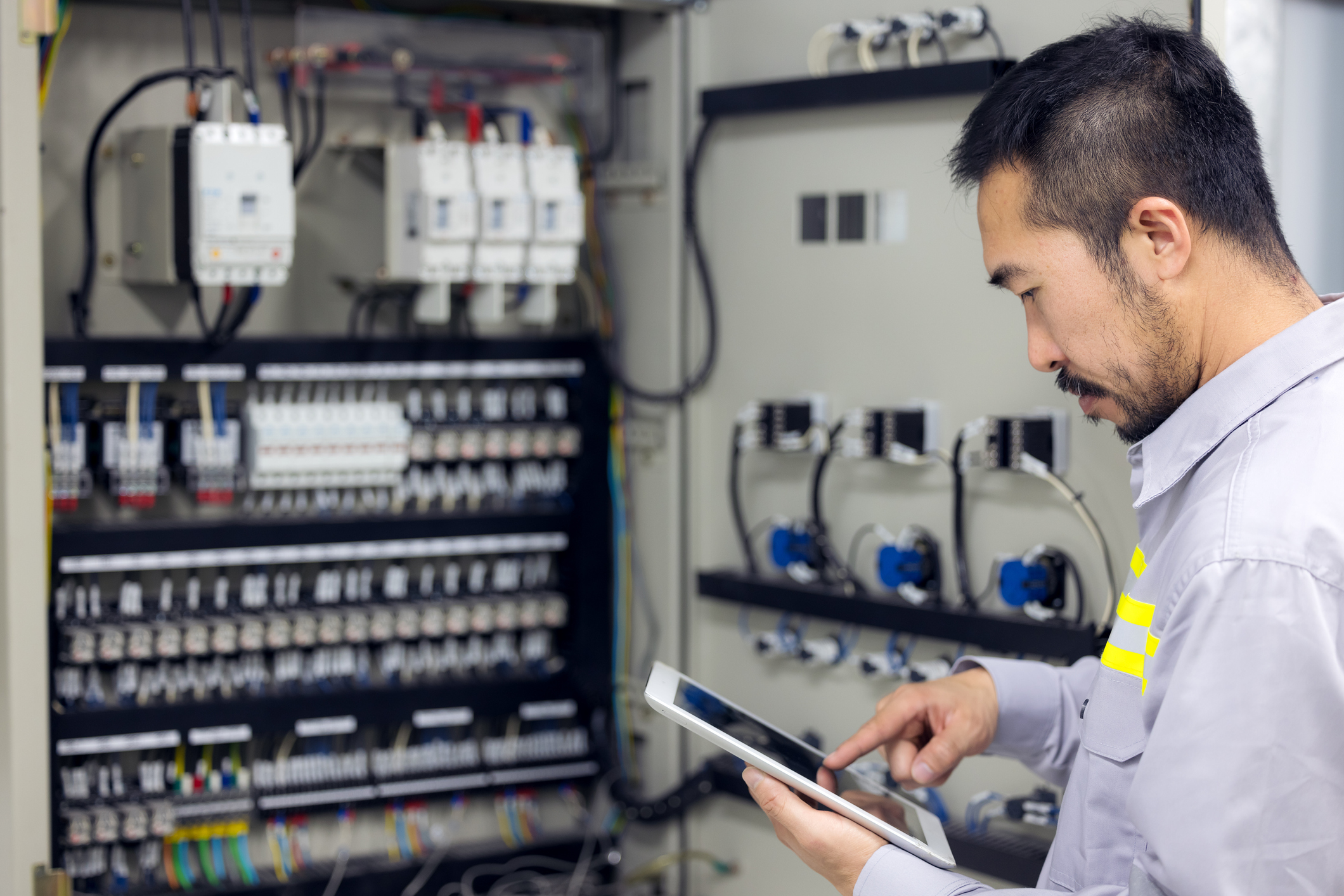 Building engineer checking electrical equipment