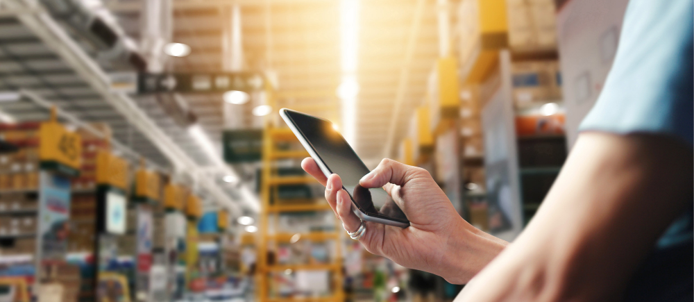 woman texting in a hardware store
