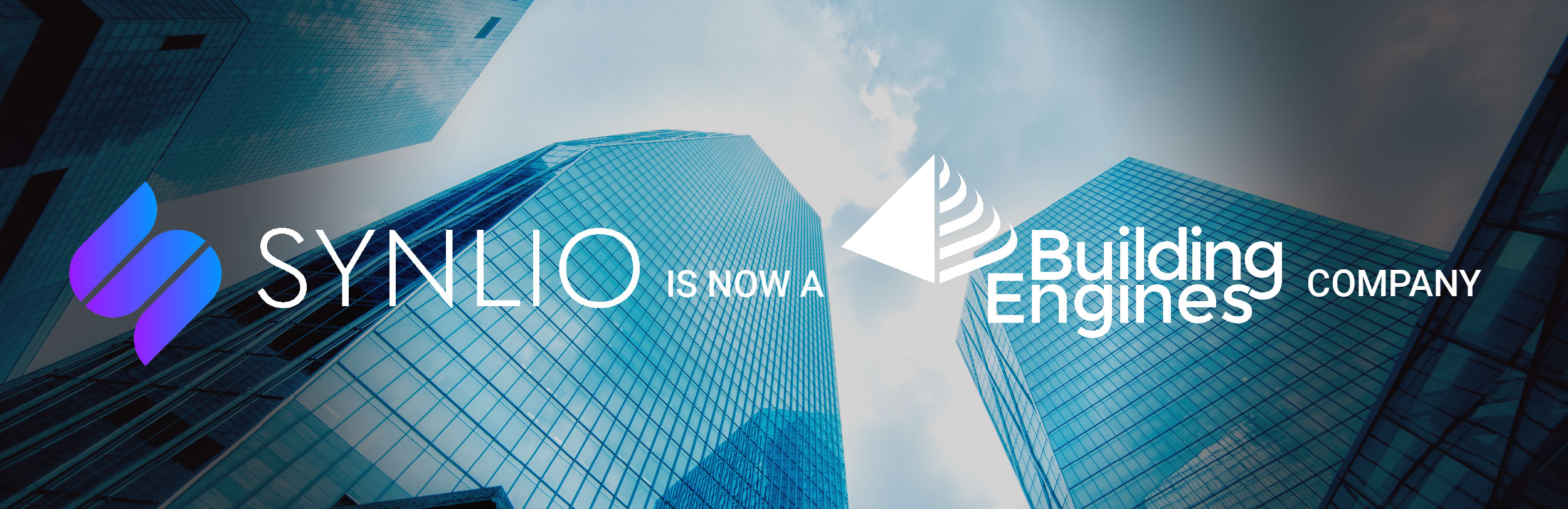 Synlio and Building Engines logo on a city skyscraper