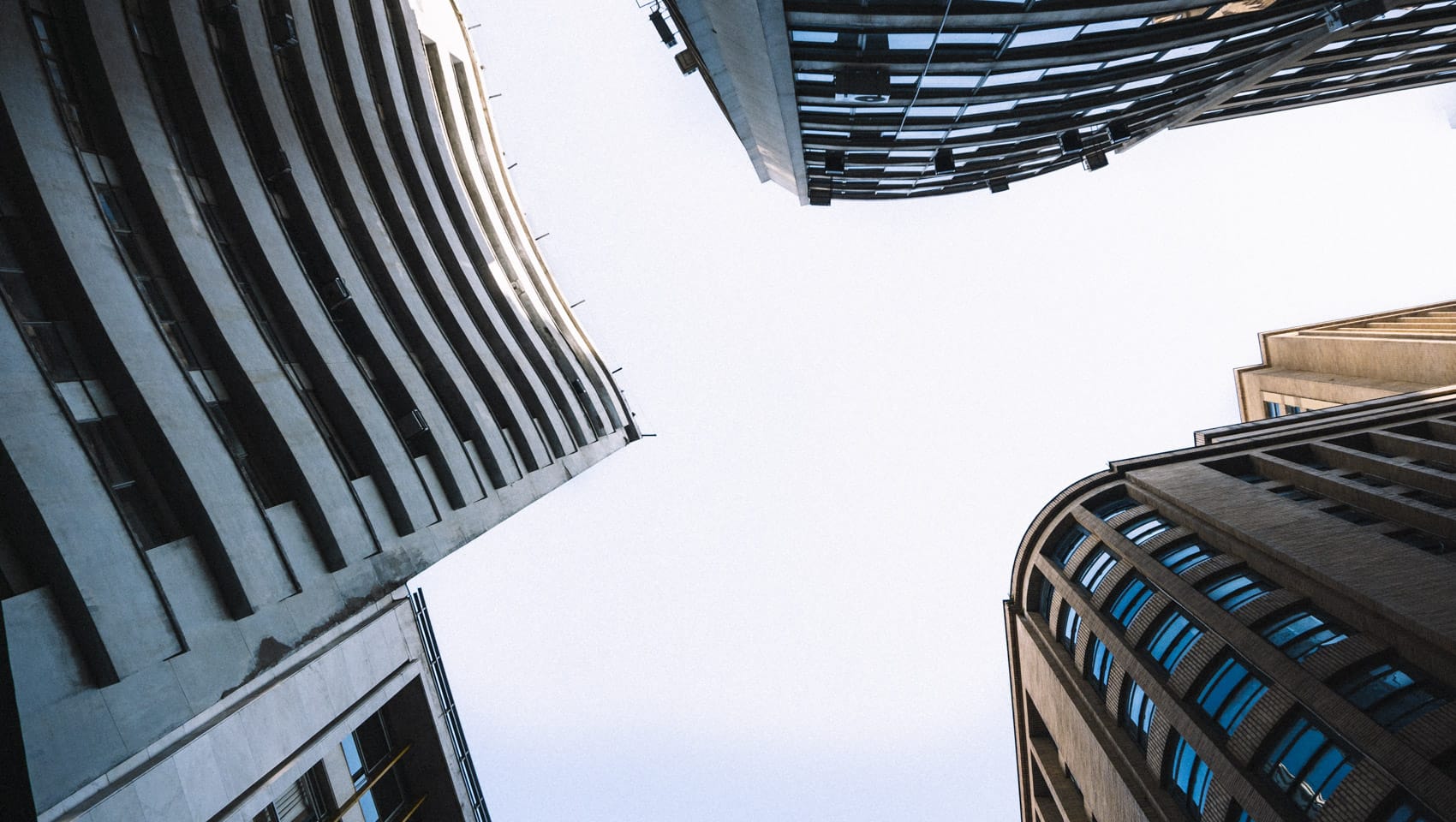 Looking up at skyscrapers