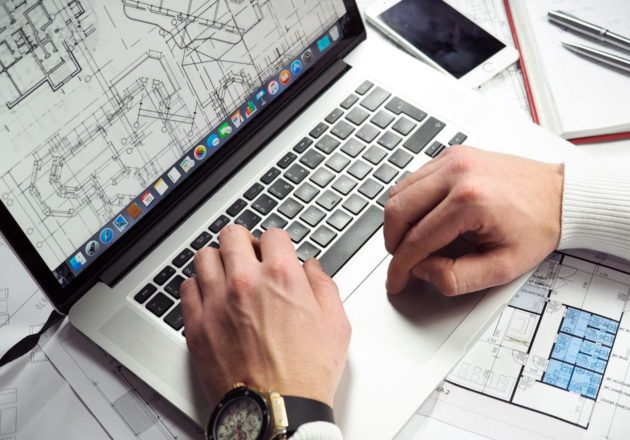 Man doing in-house area calculations on a laptop