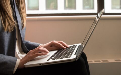 Woman typing on laptop