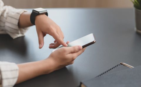 Adult using a smartphone