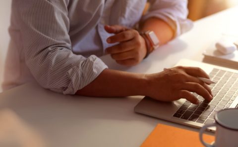 Person typing on a computer