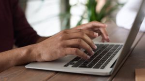 Person typing on a computer