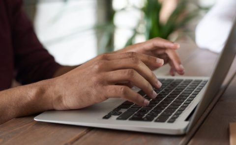 Person typing on a computer