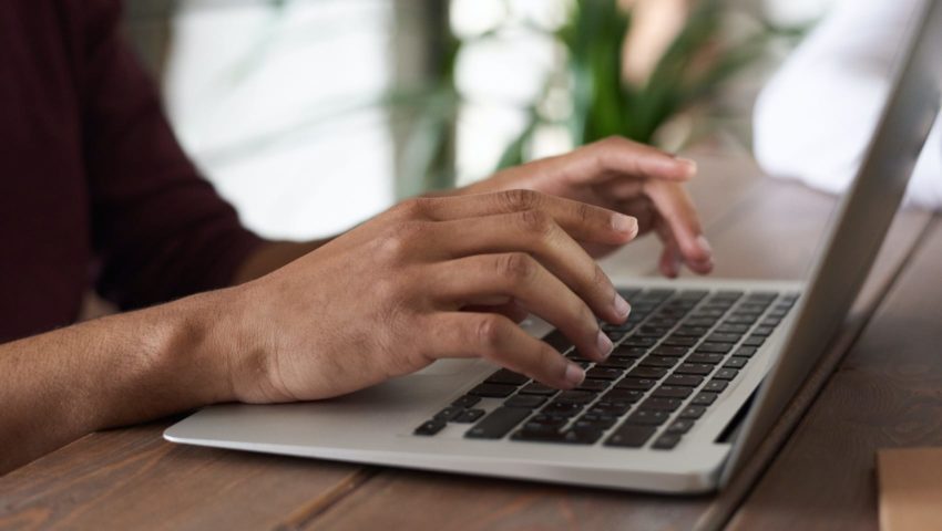 Person typing on a computer