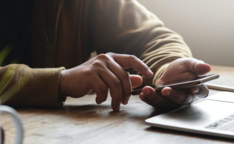 Adult using a smartphone