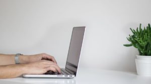 Person typing on a computer