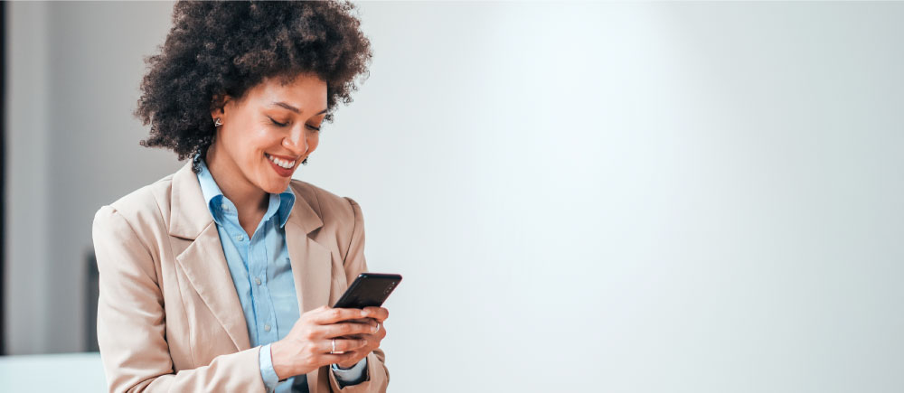 A woman reads a tenant communication on her phone