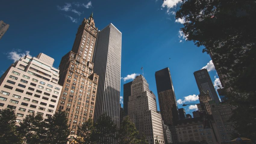 Looking up towards NYC buildings