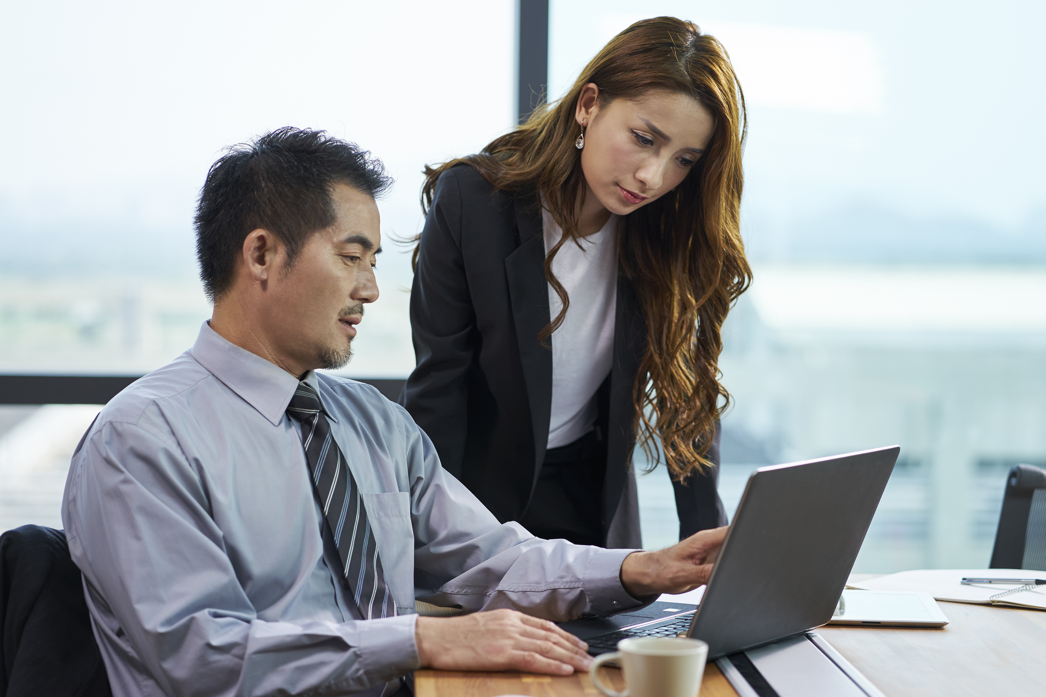 Two colleagues collaborating on a vendor RFP.