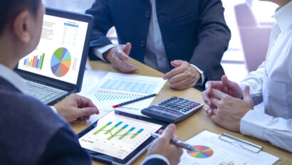 Commercial property managers reviewing financial KPIs.