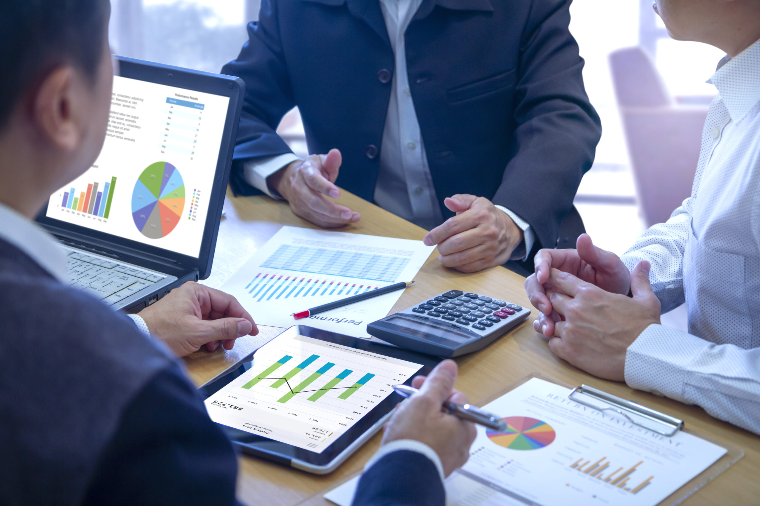Commercial property managers reviewing financial KPIs.