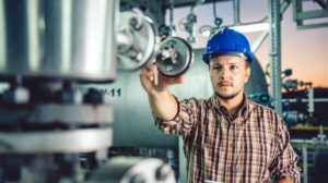 engineer checking equipment during commercial building inspections.