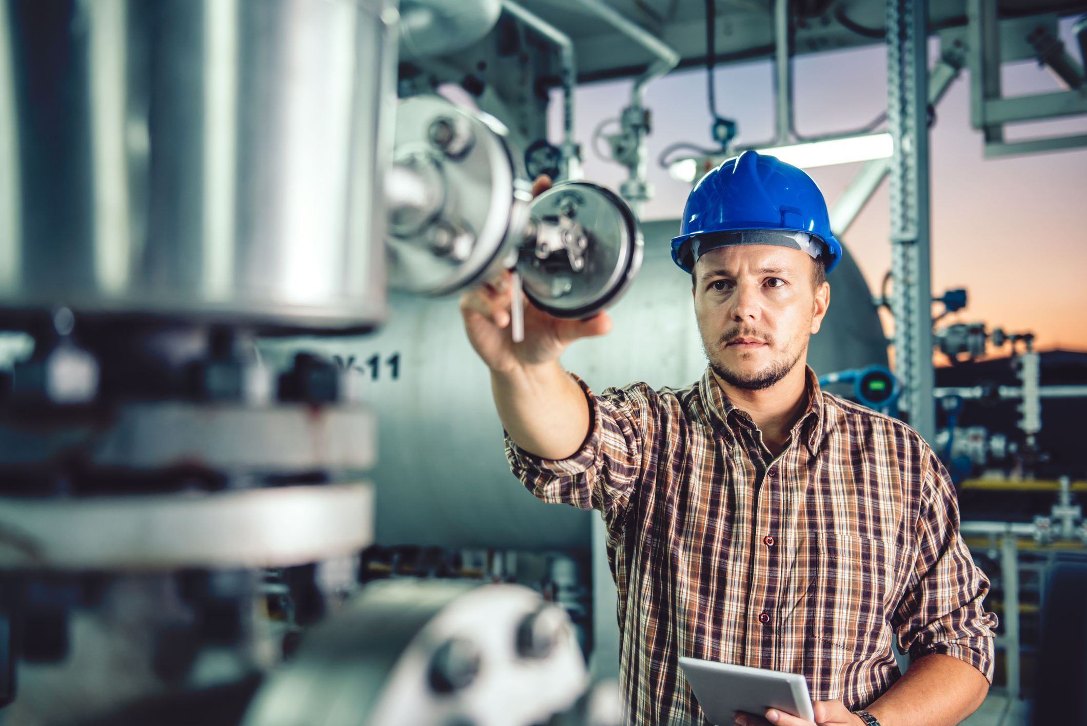 engineer checking equipment during commercial building inspections.