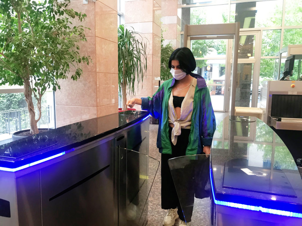 Woman entering office lobby security