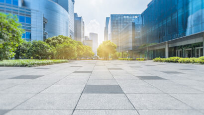 Empty brick floor with modern buildings