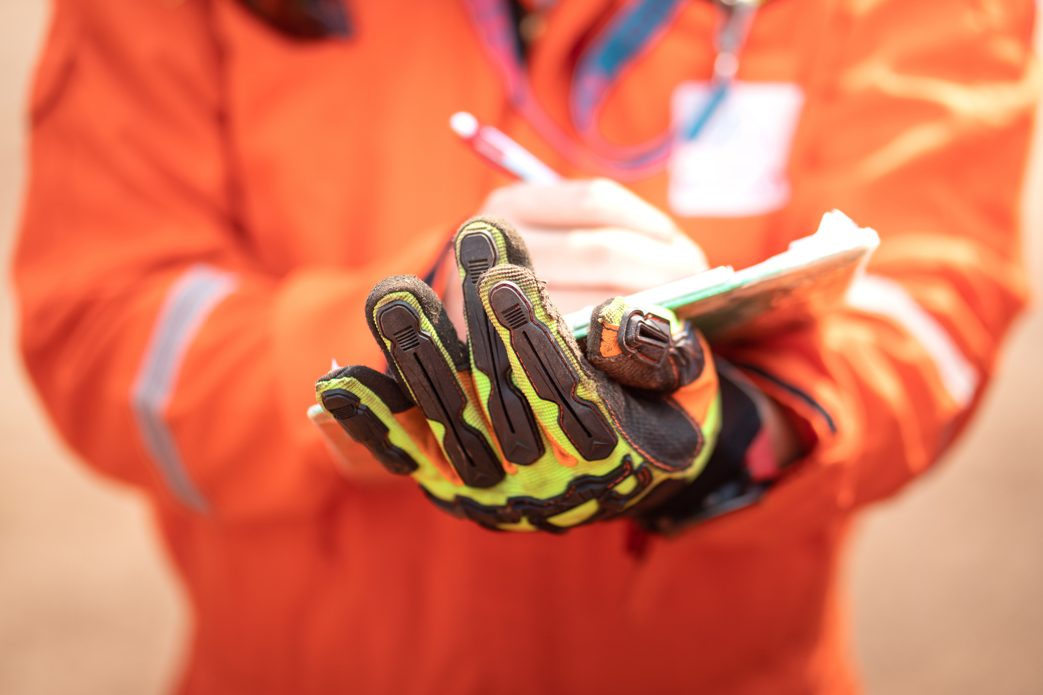CRE compliance 101: Writing note on paper during operation safety audit.