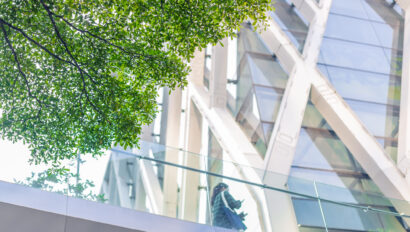 Green city, Green tree around urban office building for cool fresh air ozone saving energy.