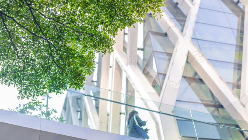 Green city, Green tree around urban office building for cool fresh air ozone saving energy.