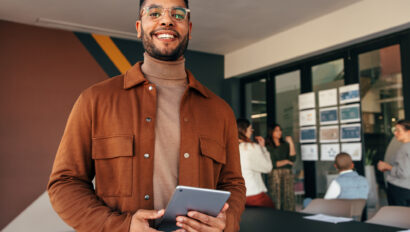 Happy businessman looking at the camera in a boardroom